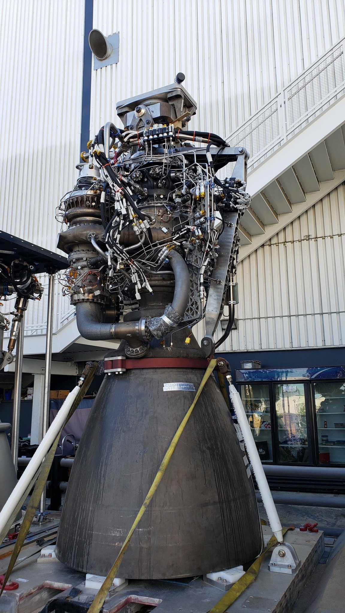 SpaceX Raptor 1 rocket engine, showing its dense network of pipes and components.